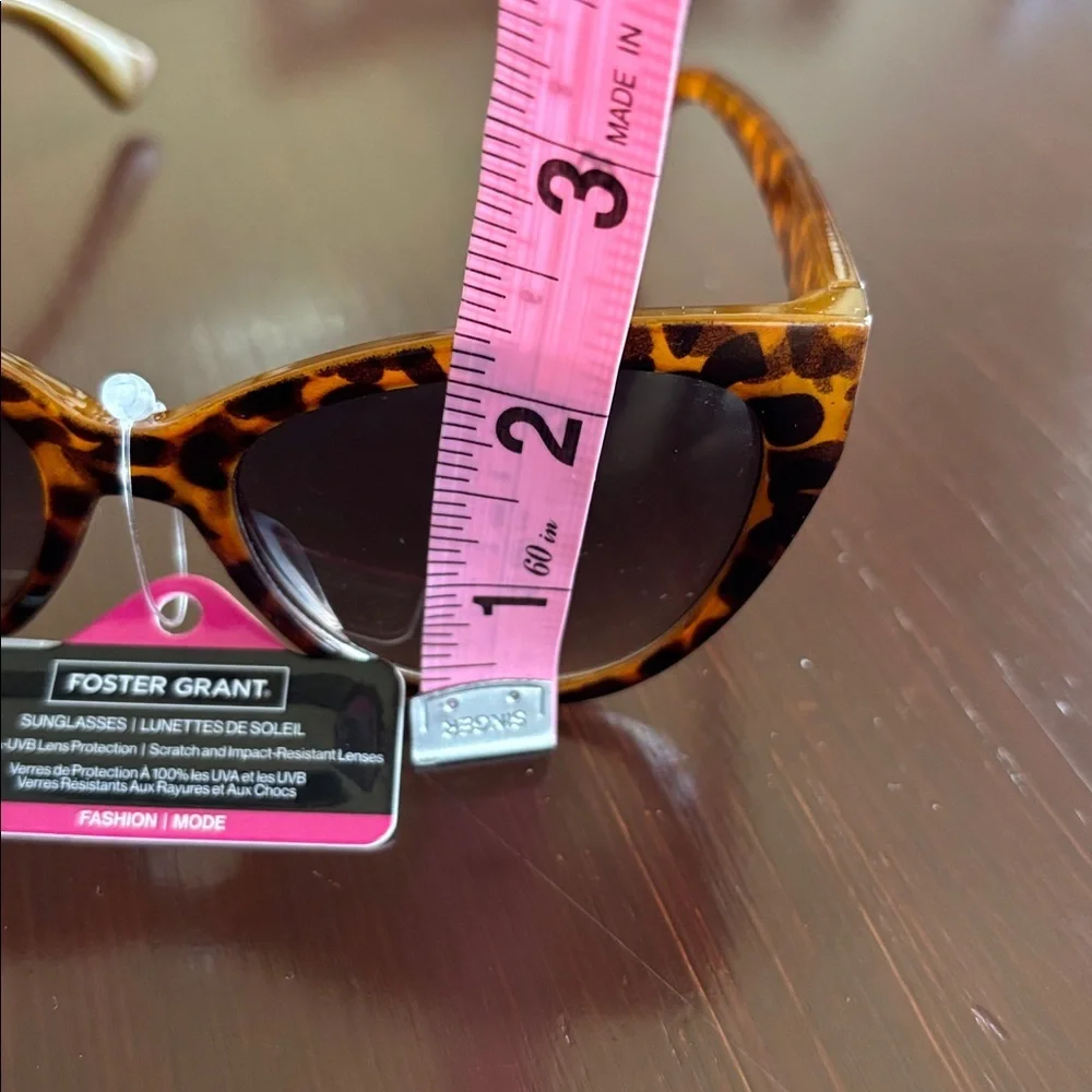 Foster Grant 100% UVA-UVB protection leopard print, gold tone beaded frame edge